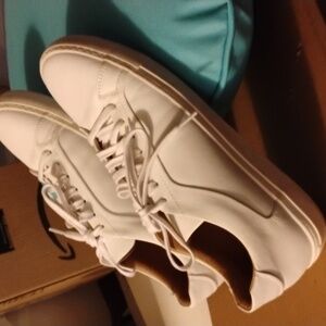 White leather sneakers in excellent condition.